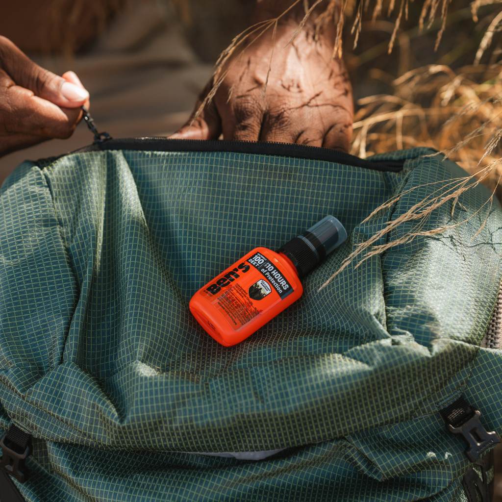 Ben's 100 Tick & Insect Repellent 1.25 oz. Pump Spray repellent sitting on top of green backpack