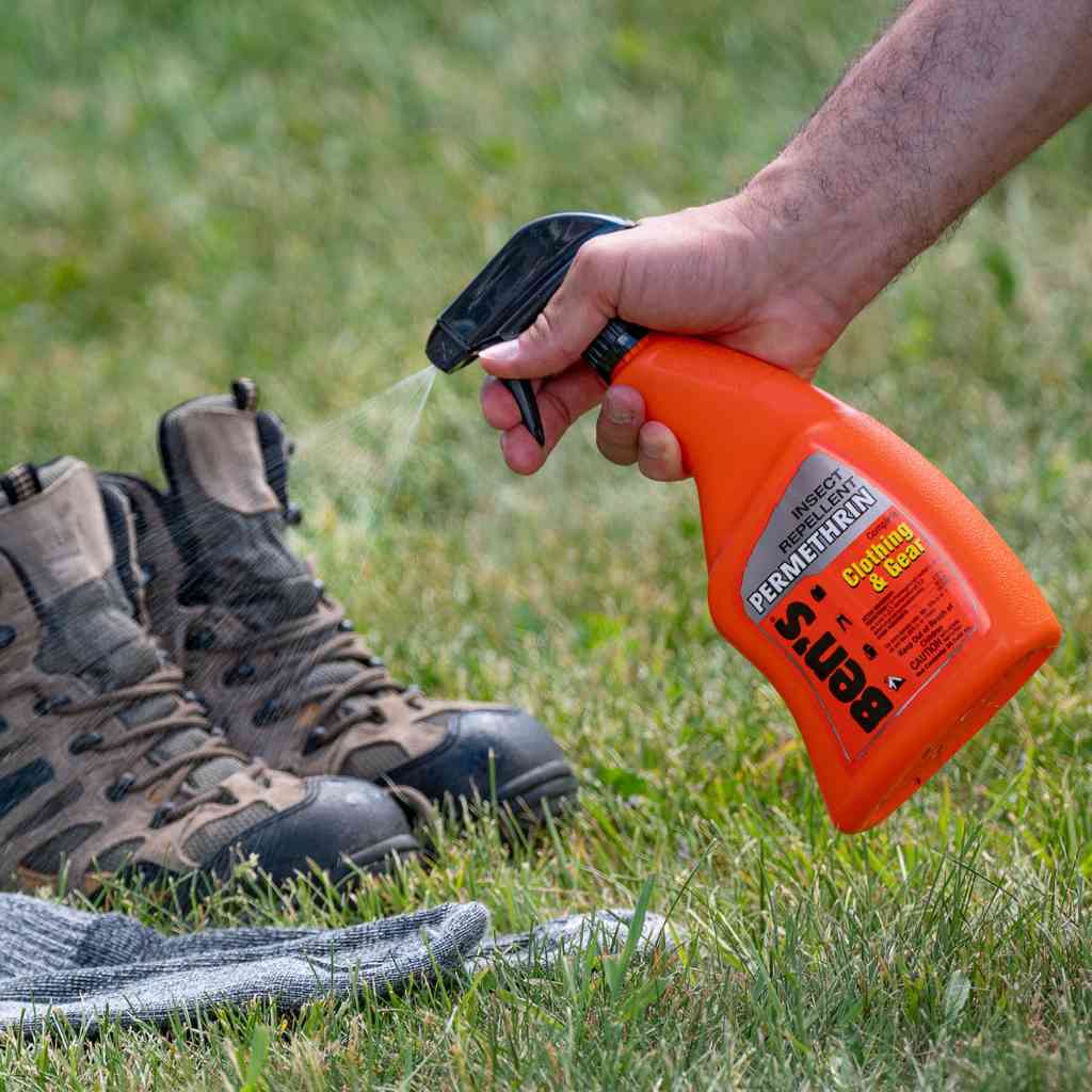 Ben's Clothing & Gear Insect Repellent 24 oz. Pump Spray spraying on hiking boots