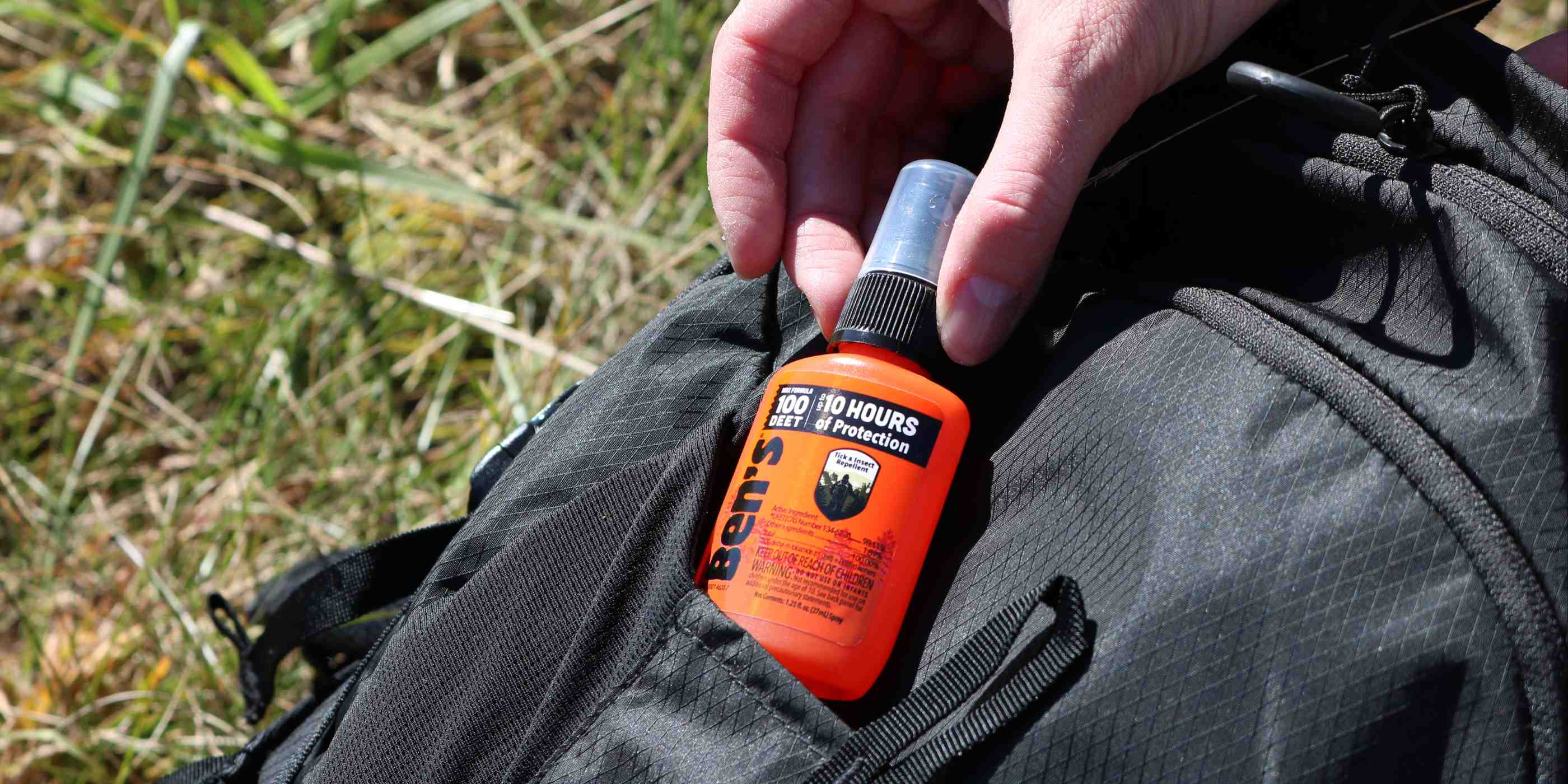 Person removing Ben's 100 1.25 oz from black backpack