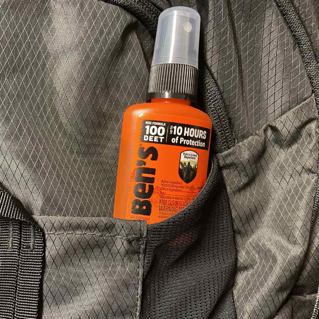 Ben's 100 Tick & Insect Repellent 1.25 oz. Pump Spray sitting in black backpack