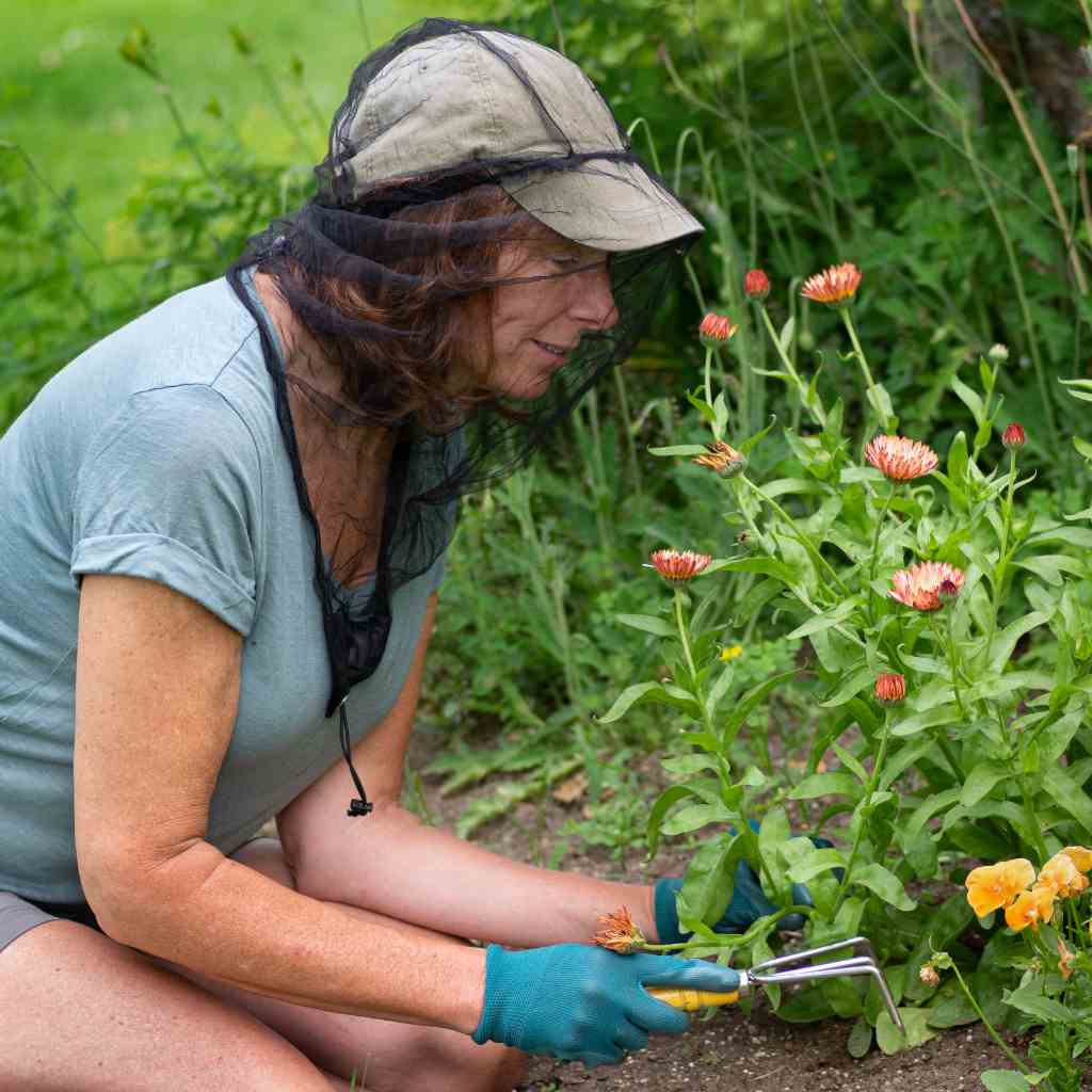 Ben's InvisiNet XTRA with Insect Shield woman using while gardening