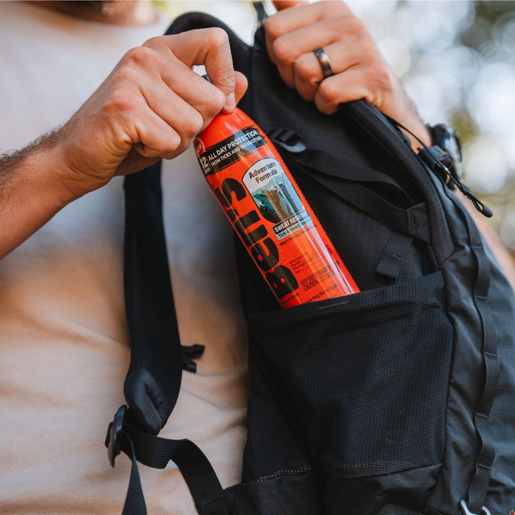 Ben's Adventure Formula 6 oz pulling from a backpack